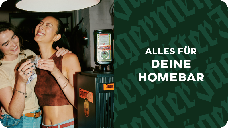 Im Vorgrund steht eine Jägermeister Tap Maschine und im Hintergrund sieht man Gläser und Hände